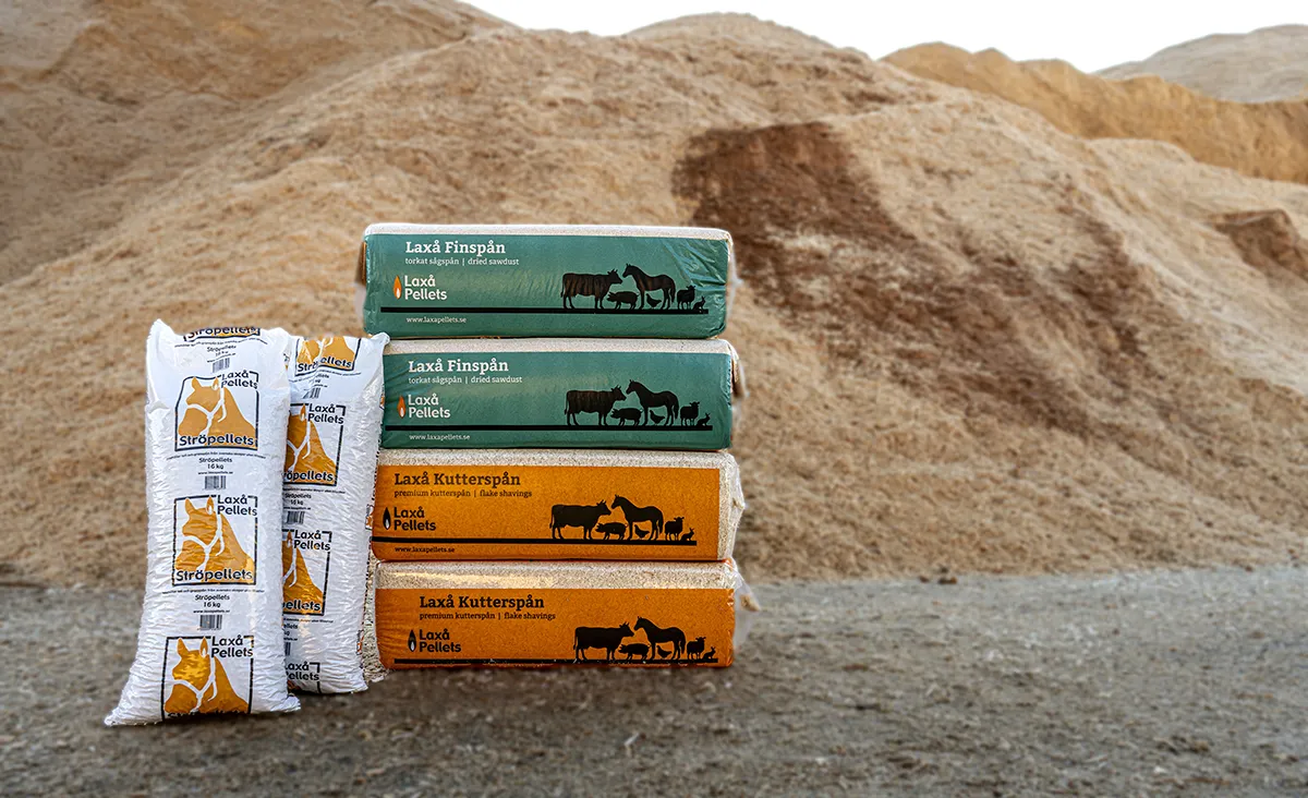 Stacked packaging of Laxå Flake shavings, Laxå Dried sawdust and Laxå Bedding pellets